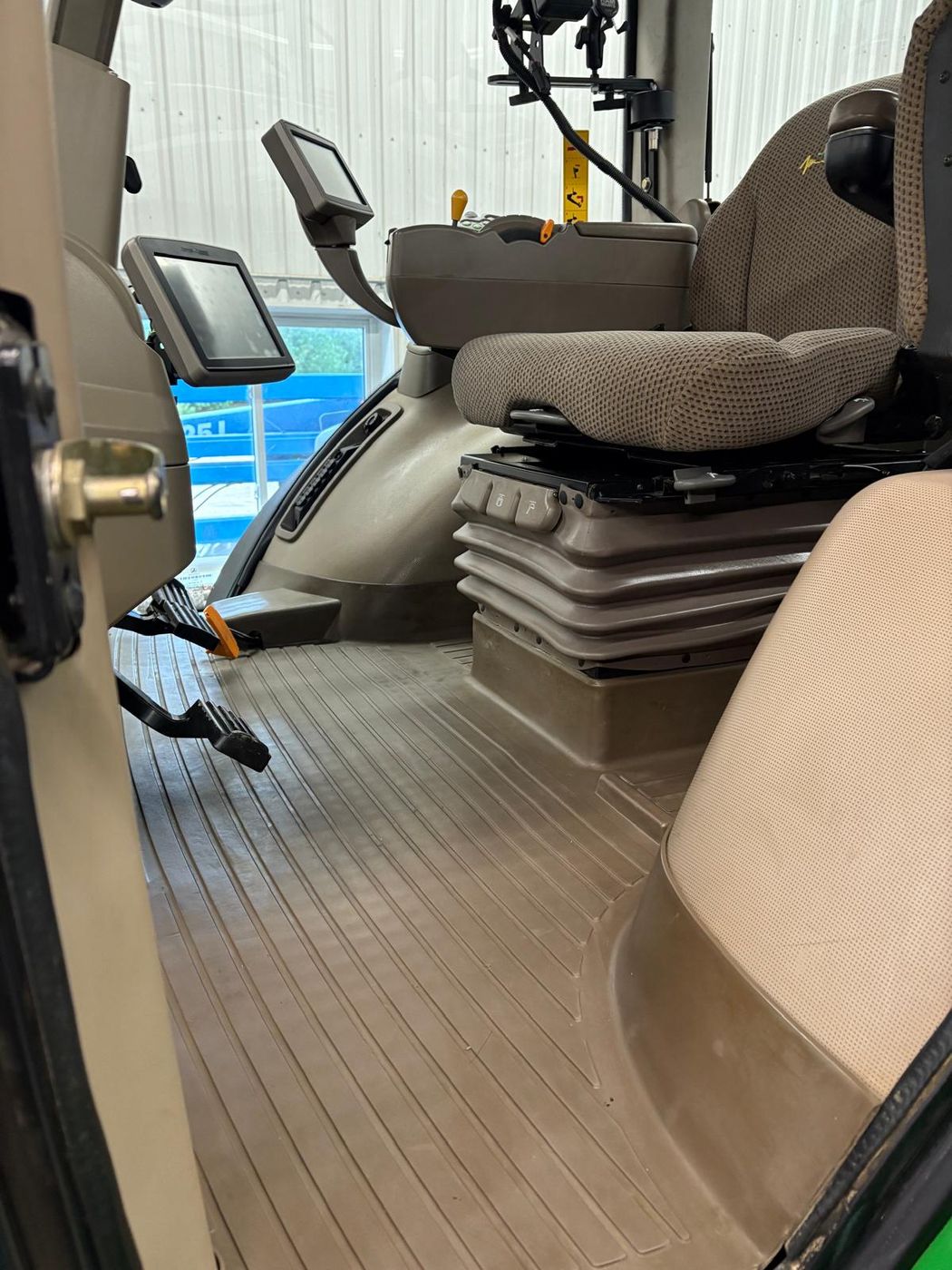 Tractor cab interior after detailing, clean seats and glass