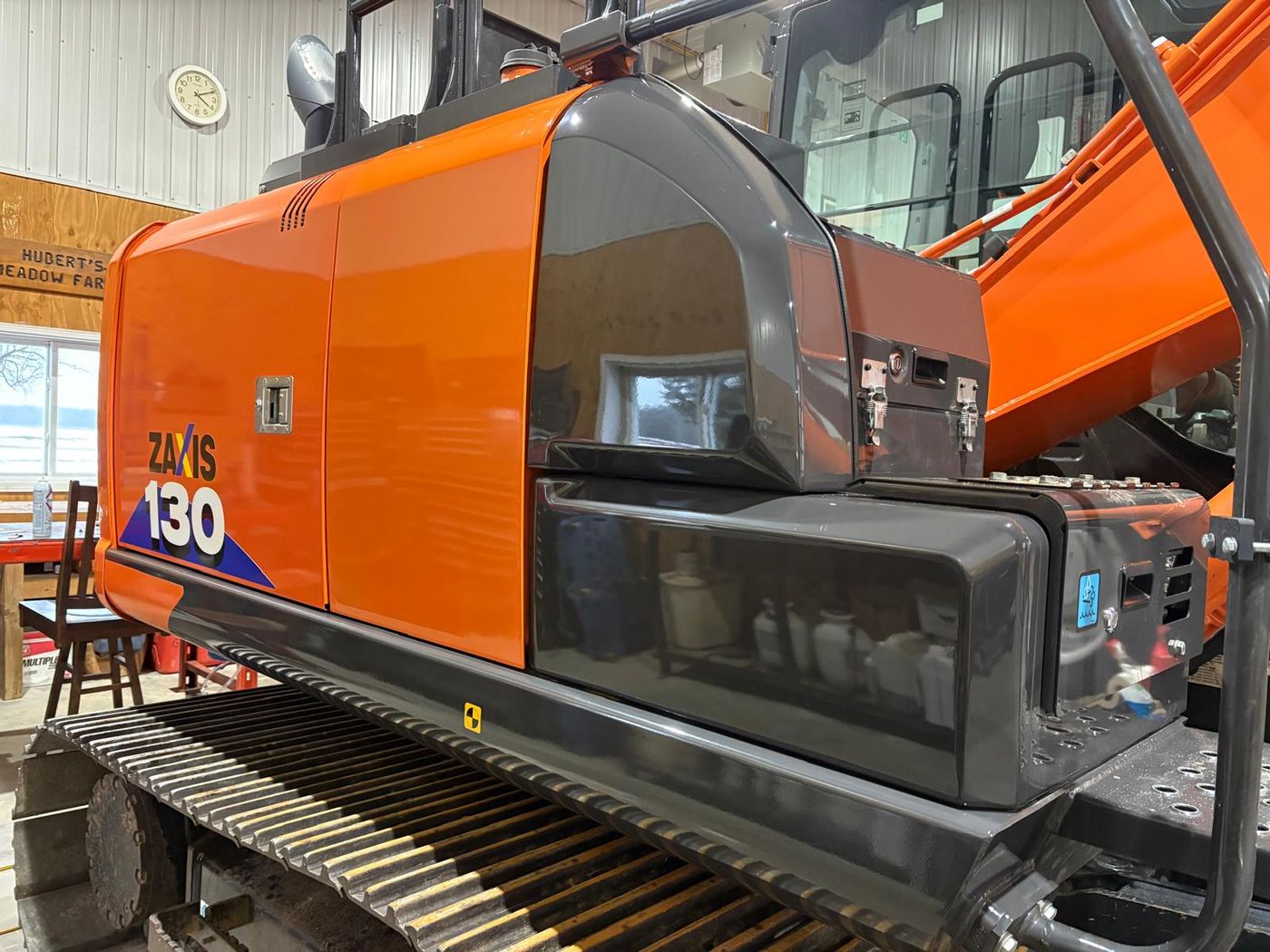 Hitachi ZX130 excavator outdoors after ceramic coating