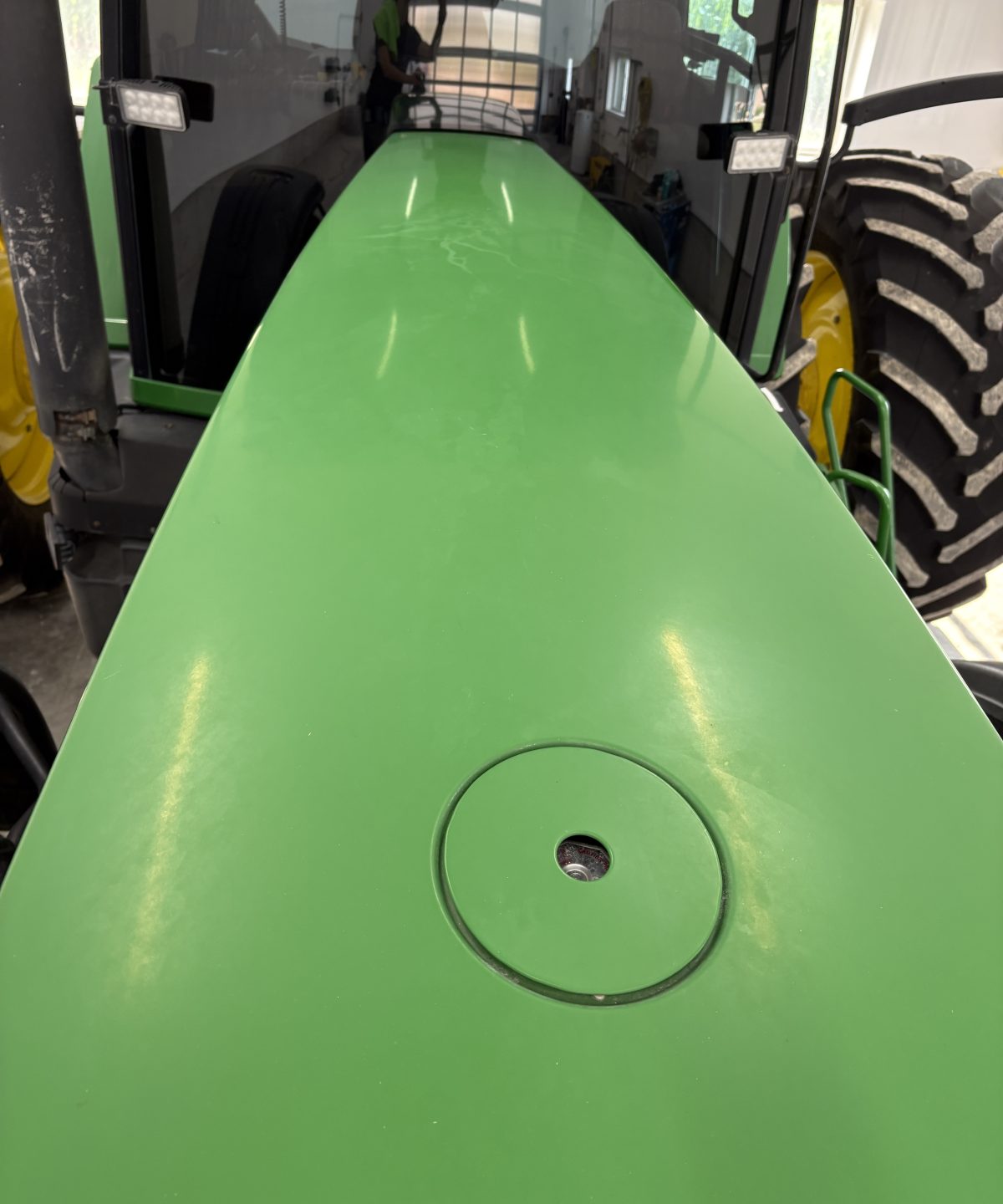 John Deere tractor hood panel before polishing, flat oxidized green paint